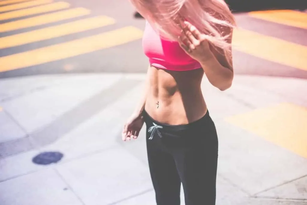 Woman with toned stomach after LA-EMS Body Sculpting Treatment Collier's Wood